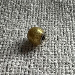 Authentic Pandora Gold glitter with silver Charm Bead